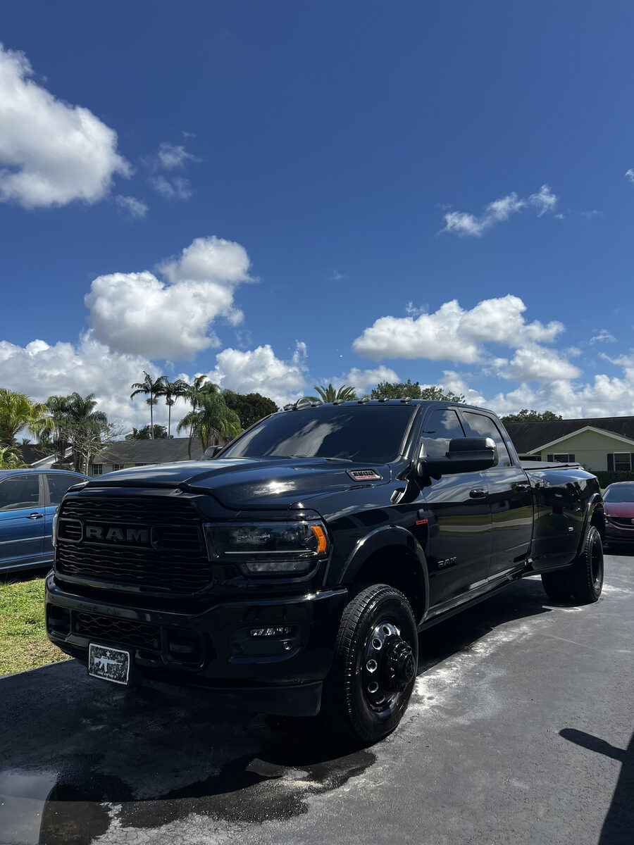 Black RAM dually truck with glossy finish after professional exterior detail